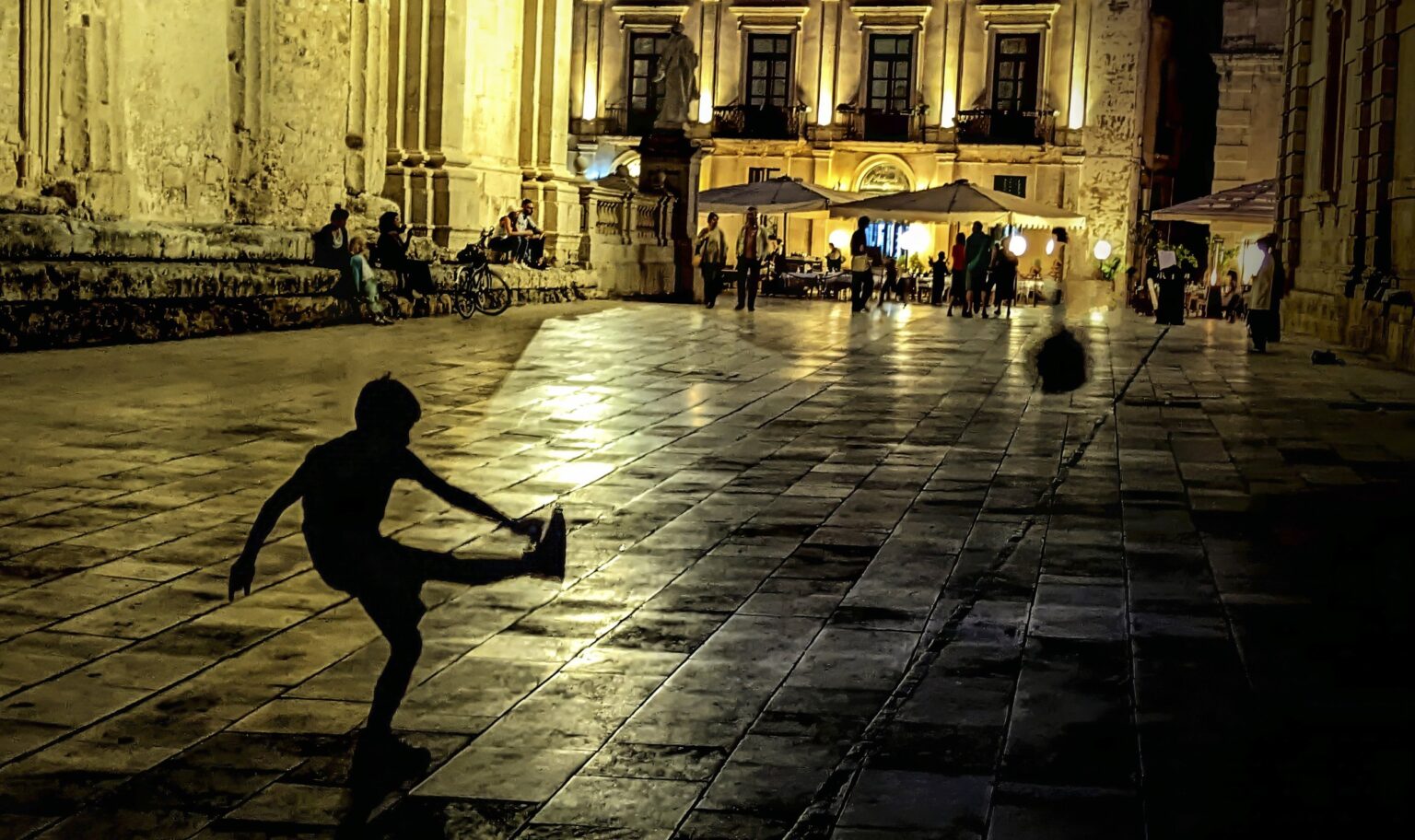 _Ortigia++LATE+PRACTICE++A+boy+uses+a+wall+to+practice+his+kick+